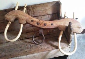 cattle yoke resting on a wooden bench, heavy weight slowing down progress and new direction