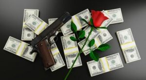 gun and red rose on top of dollar bills, attitude to money and wealth, USA guns, roses, 